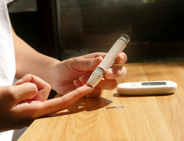 Blood sugar monitoring equipment on a table