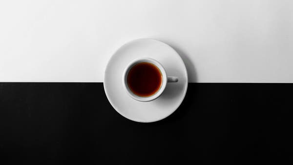 A pack and cup of coffee on a bright, premium kitchen counter in warm natural daylight