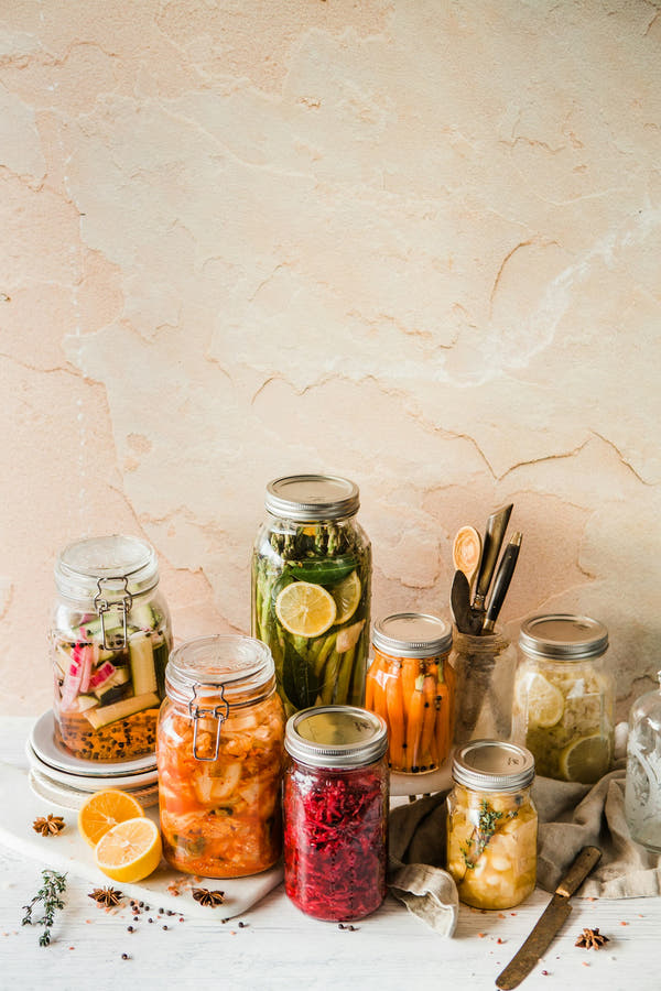 Jars of colourful fermented vegetables for gut health