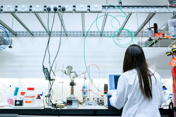 A scientist working in a clean research laboratory